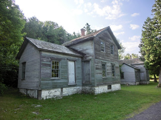 Fototapeta na wymiar Abandoned vintage old weathered wooden country farmhouse 