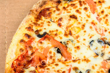 Italian Pizza With Mozzarella, Prosciutto, Tomatoes And Olives
