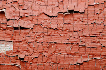 Red Painted old wall. Abstract cracked brown texture. Rustic background