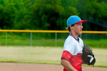 Teenage baseball player during a game.