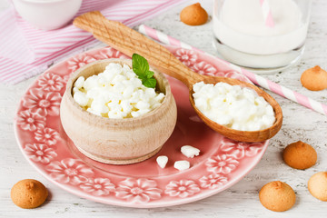 Cottage cheese, milk and small cookies for breakfast