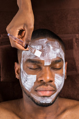 Face Mask Applied To Young Man