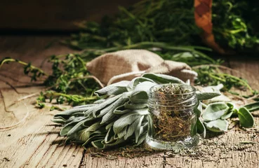 Poster Dried sage in a glass jar, fresh sage on the vintage wooden tabl © 5ph