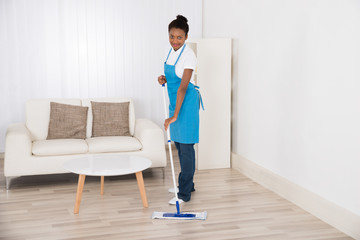 Female Janitor Mopping Floor