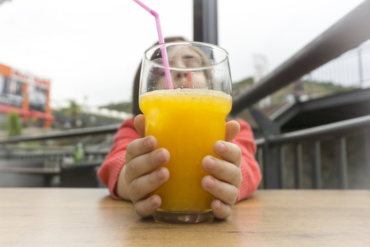 Children Drinking Orange Juice