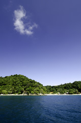 idyllic island with blue sky background
