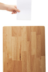 hand put paper on wood box