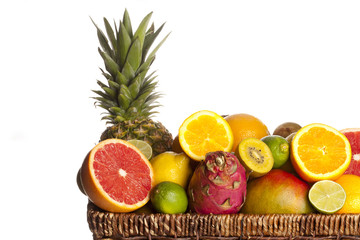 cropped view of a slices of fruits in wicker basket.
