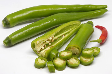 fresh chilli with spices on white