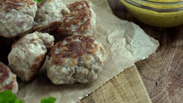 Portion of Mini Burgers as not seamless loopable 4K UHD footage