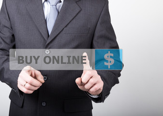 technology, internet and networking concept - Businessman presses buy online button on virtual screens. Internet technologies in business