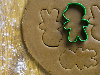 gingerbread cookie cutter on dough