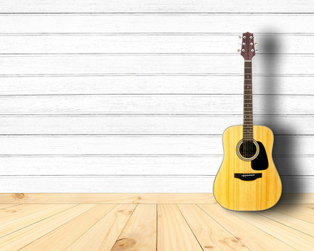Acoustic guitar in vintage wood room.