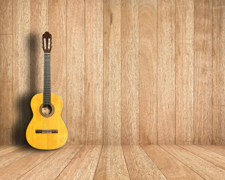 Classical guitar in vintage wood room.