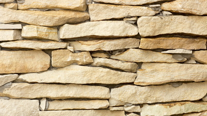 Wall of yellow coquina blocks closeup