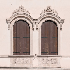 Decorated arched windows of a medieval palace.