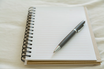pen on blank notebook