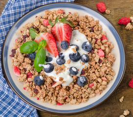 Healthy Breakfast. Muesli, berries with yogurt.  Diet concept.