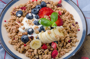 Healthy Breakfast. Muesli and berries with yogurt.  Diet concept