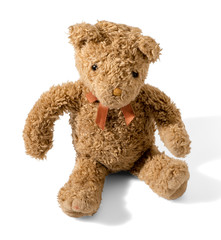 Old plush brown teddy bear wearing a bow-tie