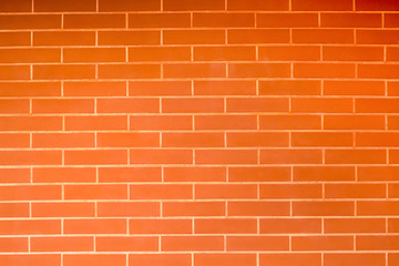 Old vintage orange red brick wall background. Texture pattern of red brick wall for wallpaper.