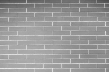 Black and white old vintage brick wall background. Texture pattern of gray brick wall for wallpaper.