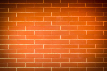 Old vintage orange red brick wall background. Texture pattern of red brick wall for wallpaper.