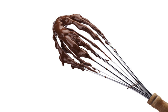 chocolate syrup on wire whisk