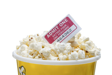 cropped image of a popcorn with cinema ticket