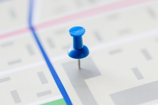 Close Up Of Map Or City Plan With Pin