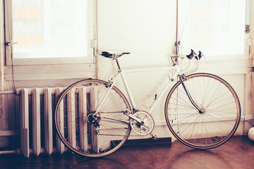 Fototapeta na wymiar White retro bicycle in studio