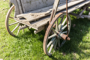 Fototapeta na wymiar part of a wooden wagon with wheels