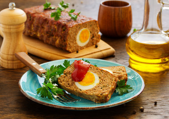 Baked meat loaf with eggs for Easter holiday.