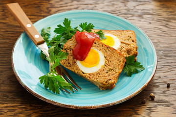 Baked meat loaf with eggs for Easter holiday.