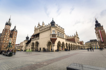Fototapeta na wymiar Market square with historic church, cloth hall, town hall in Krakow, Poland, Europe