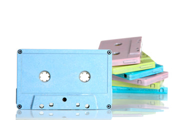 blue audio cassette in the background other audio cassette on white isolated background