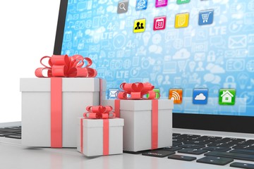 Gift box with ribbon bow on laptop keyboard. 3d rendering.