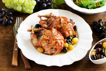 Baked stuffed quail with grape sauce.