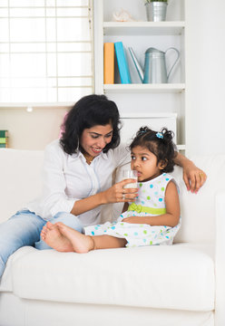 Indian Mother And Child Drinking Milk