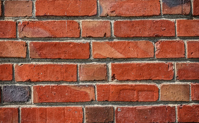 Obraz premium Vibrant and Saturated Brick Wall for Texture Background