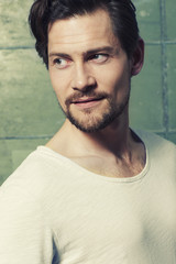 Close up of man in studio, looking away