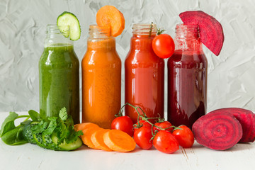 Selection of colorful vegetable juices in glass jars