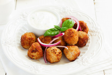 Homemade meatballs with cream sauce.
