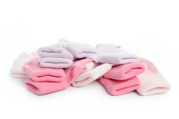 colorful of new kid's baby socks stacked and isolated