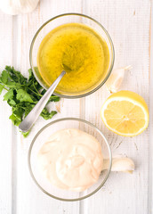 pink sauce and vinaigrette dressing in glass bowl