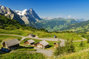 Beautiful idyllic mountains landscape with country house (chalet) in summer, Alps, Switzerland
