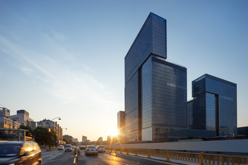 business buildings in modern city at sunrise