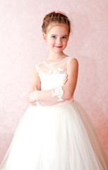 Adorable smiling little girl in white princess dress © svetamart