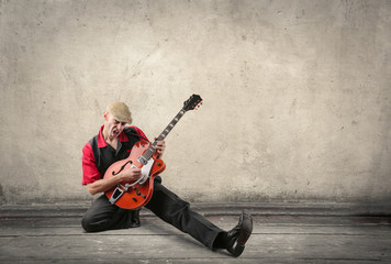 Naklejka premium Guitarist playing