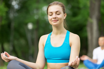 Fototapeta premium Having yoga practice in park